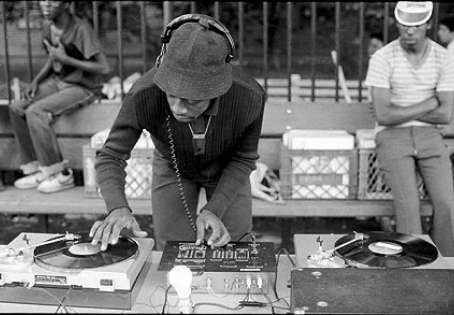 DJ spinning turntables
